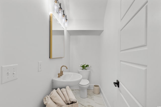985 Shipmaster Ave, Myrtle Beach, SC 29579 - bathroom with baseboards, a sink, marble finish floor, and toilet