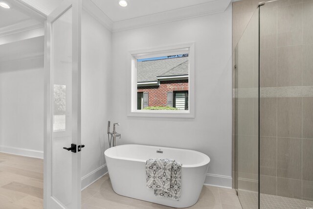 985 Shipmaster Ave, Myrtle Beach, SC 29579 - full bathroom featuring crown molding, a freestanding tub, baseboards, and tiled shower