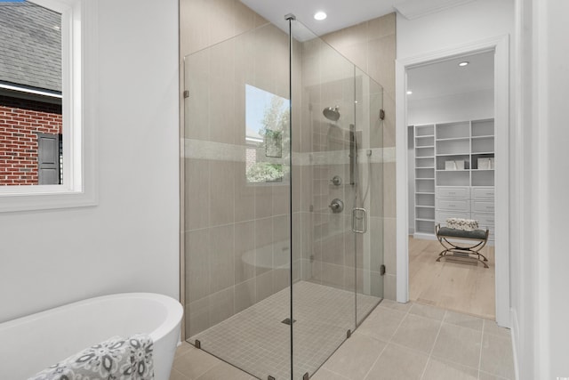 985 Shipmaster Ave, Myrtle Beach, SC 29579 - full bathroom featuring a freestanding tub, a spacious closet, a shower stall, and tile patterned floors