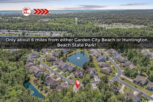156 Summerlight Dr, Murrells Inlet, SC 29576 - aerial overview of property's location featuring a heavily wooded area, a nearby body of water, and nearby suburban area