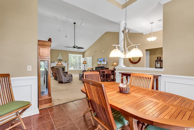 156 Summerlight Dr, Murrells Inlet, SC 29576 - dining space with dark colored carpet, dark tile patterned floors, ceiling fan, a wainscoted wall, and high vaulted ceiling