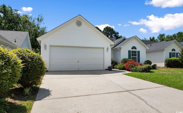 ranch-style home with concrete driveway