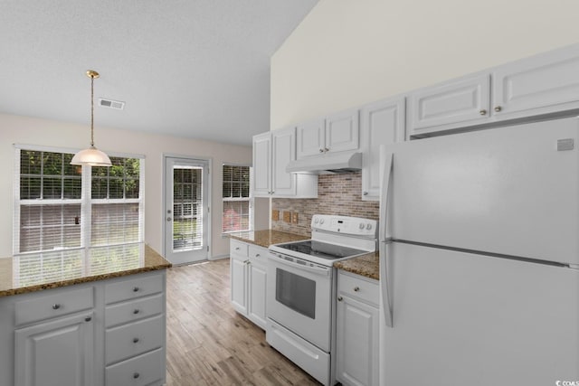 kitchen featuring visible vents, decorative backsplash, white appliances, under cabinet range hood, and white cabinets