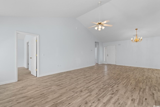 unfurnished living room with high vaulted ceiling, baseboards, ceiling fan with notable chandelier, and light wood-type flooring