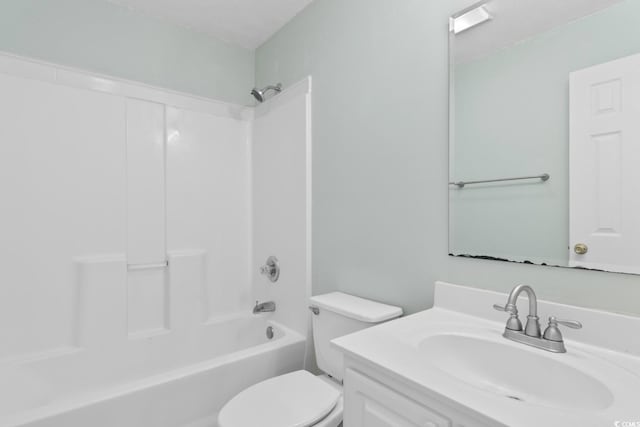 bathroom with vanity, washtub / shower combination, and toilet
