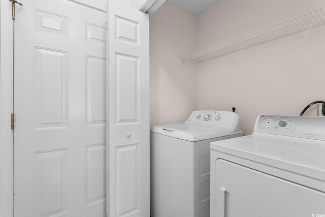 laundry area featuring laundry area and washing machine and clothes dryer