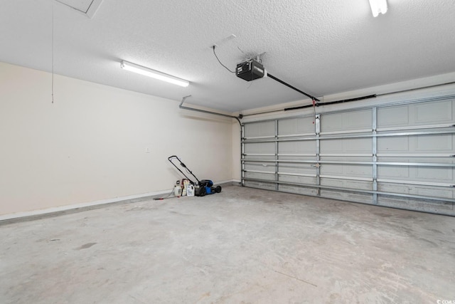 garage with baseboards and a garage door opener