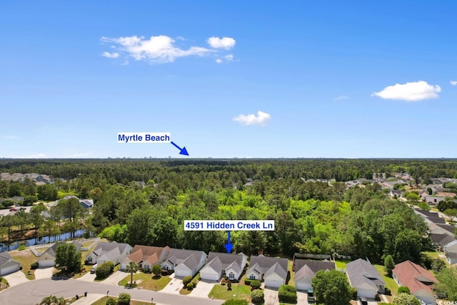 aerial view with a residential view and a wooded view