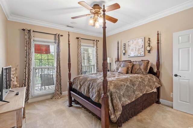 bedroom featuring ornamental molding, light carpet, visible vents, and baseboards