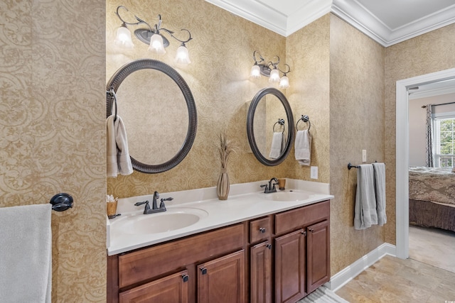 ensuite bathroom featuring wallpapered walls and a sink