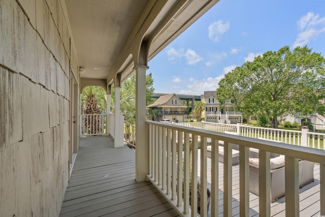 wooden terrace with a residential view