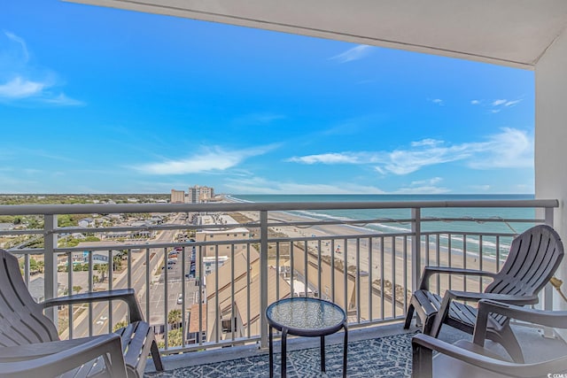 balcony featuring a water view
