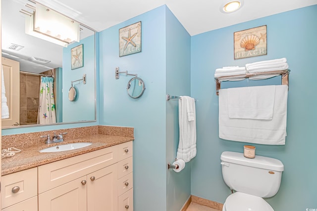 bathroom featuring visible vents, baseboards, toilet, and vanity