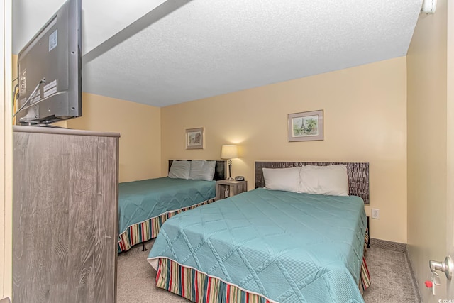 2301 S Ocean Blvd Unit 1202, North Myrtle Beach, SC 29582 - carpeted bedroom featuring a textured ceiling