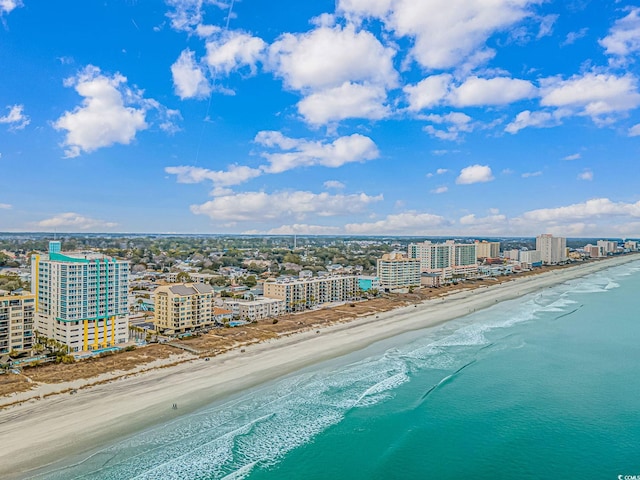 birds eye view of property with a city view, a beach view, and a water view