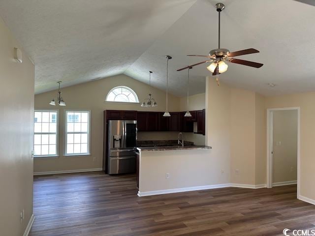 kitchen with a ceiling fan, dark wood finished floors, lofted ceiling, and stainless steel fridge with ice dispenser