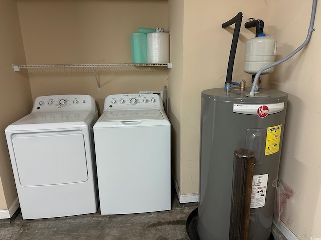 laundry area with laundry area, independent washer and dryer, and electric water heater