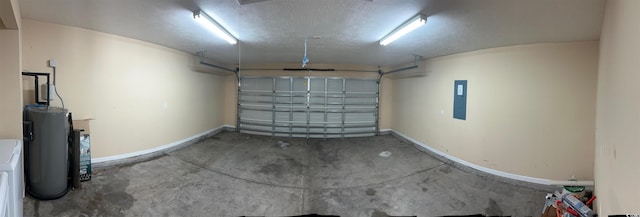 garage featuring baseboards, washer / dryer, water heater, and electric panel