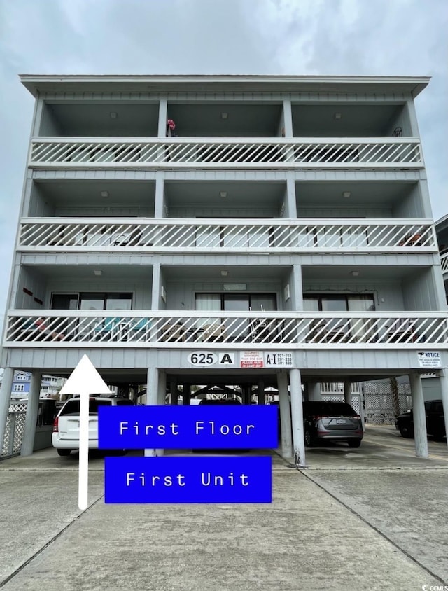 view of property featuring covered parking