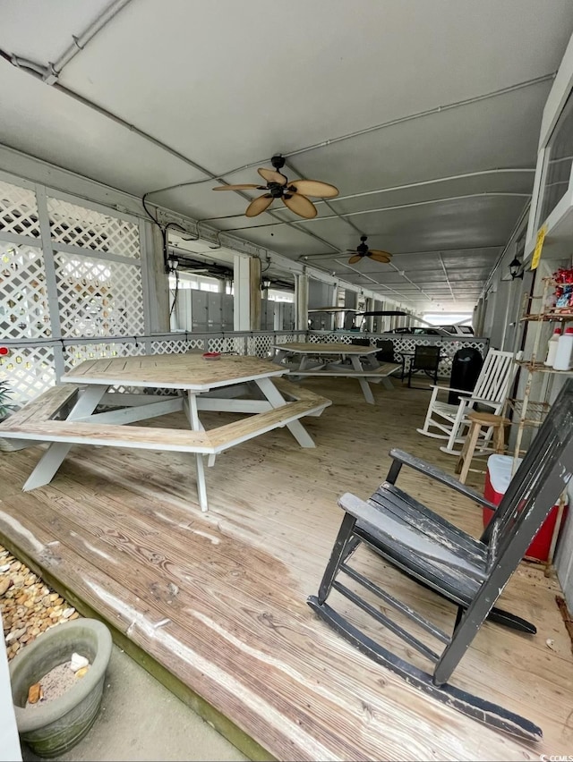 deck featuring ceiling fan and outdoor dining space