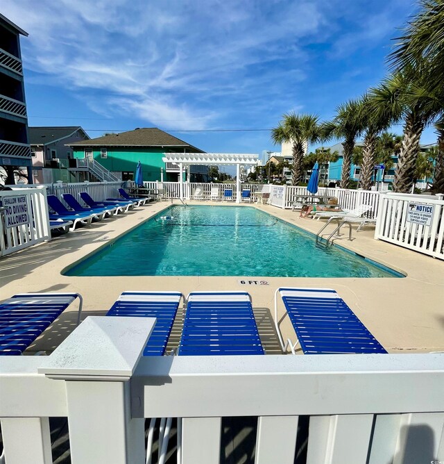 625 N Waccamaw Dr Unit 101, Murrells Inlet, SC 29576 - community pool with fence, a pergola, and a patio area
