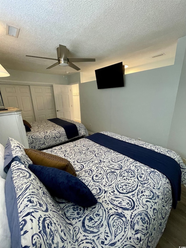 625 N Waccamaw Dr Unit 101, Murrells Inlet, SC 29576 - bedroom with a closet, a textured ceiling, and ceiling fan