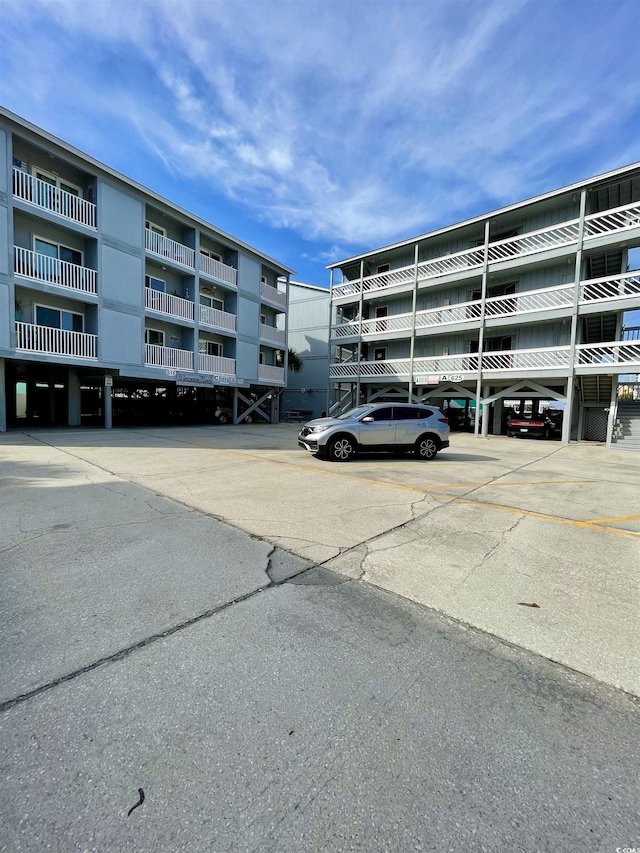 625 N Waccamaw Dr Unit 101, Murrells Inlet, SC 29576 - view of apartment building / complex featuring parking