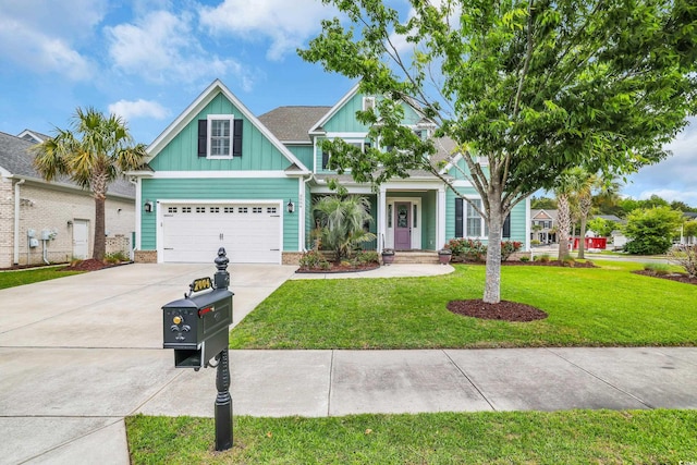 craftsman-style house with board and batten siding, an attached garage, concrete driveway, and a front lawn