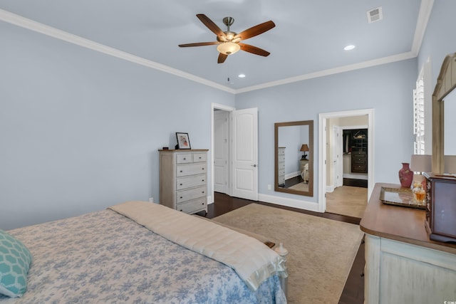 bedroom featuring ornamental molding, recessed lighting, wood finished floors, and visible vents