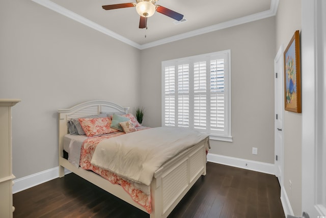 bedroom featuring crown molding, visible vents, wood finished floors, baseboards, and ceiling fan