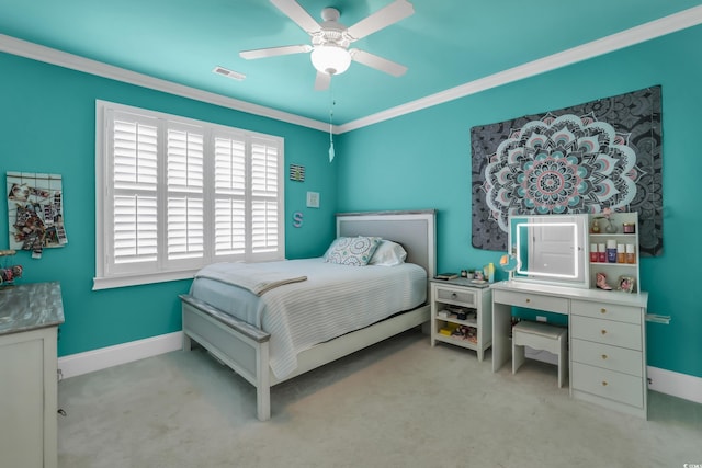 bedroom with carpet floors, baseboards, visible vents, and crown molding
