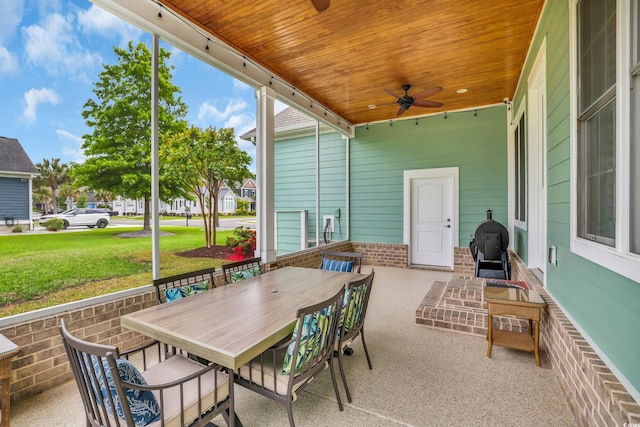 view of patio / terrace with a ceiling fan and outdoor dining space