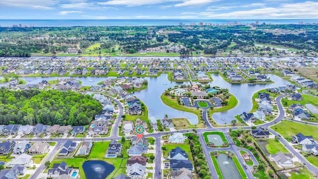 drone / aerial view with a residential view and a water view
