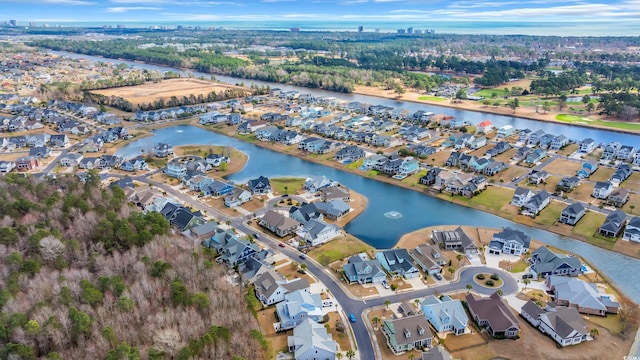 bird's eye view with a residential view and a water view
