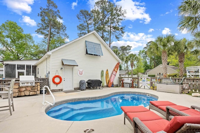 view of swimming pool featuring fence, a sunroom, a fenced in pool, a patio, and a grill