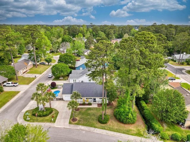 drone / aerial view featuring a view of trees