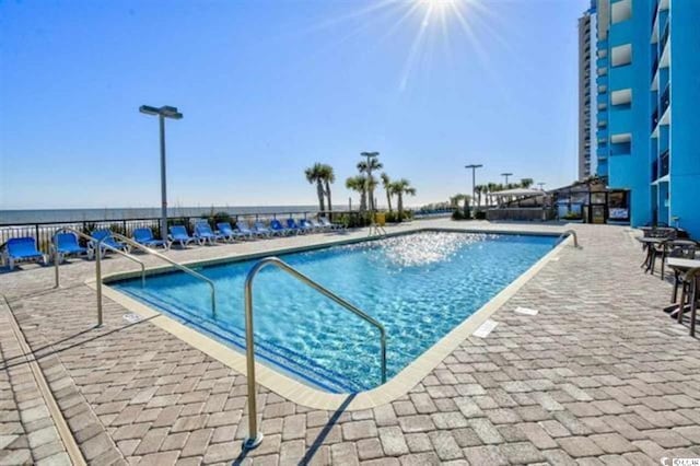 pool with a patio area