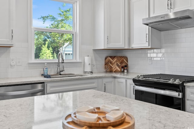 kitchen featuring a sink, gas stove, white cabinetry, under cabinet range hood, and stainless steel dishwasher