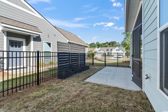 view of yard with fence and mail area