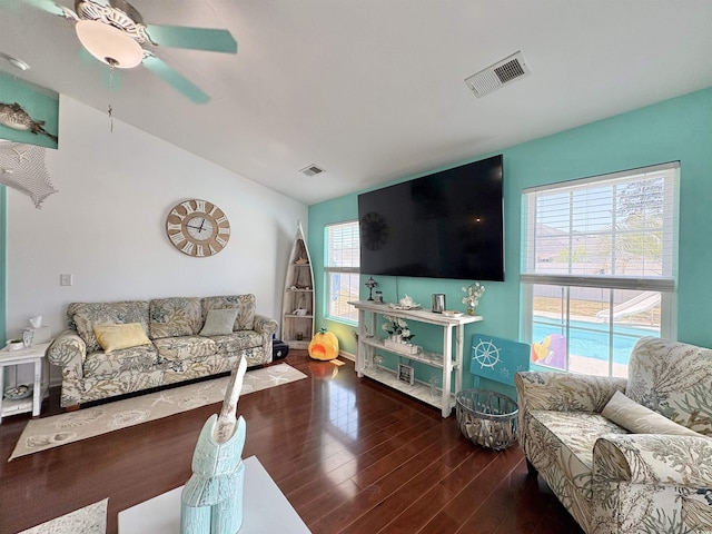 living room with ceiling fan, visible vents, a wealth of natural light, and wood finished floors
