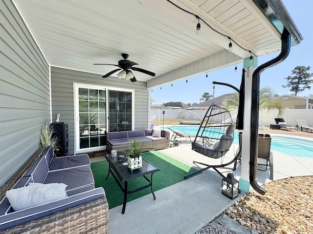 view of patio featuring a fenced in pool, a fenced backyard, a ceiling fan, and outdoor lounge area