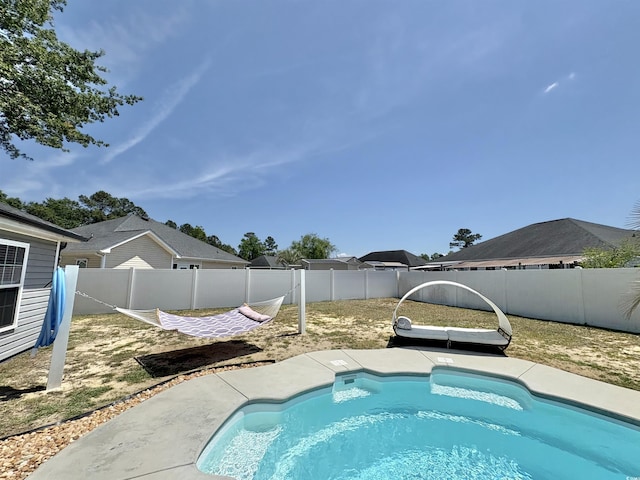 view of pool featuring a fenced in pool and a fenced backyard