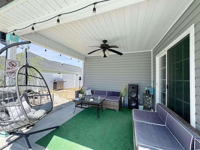 view of patio featuring ceiling fan, fence, and an outdoor hangout area