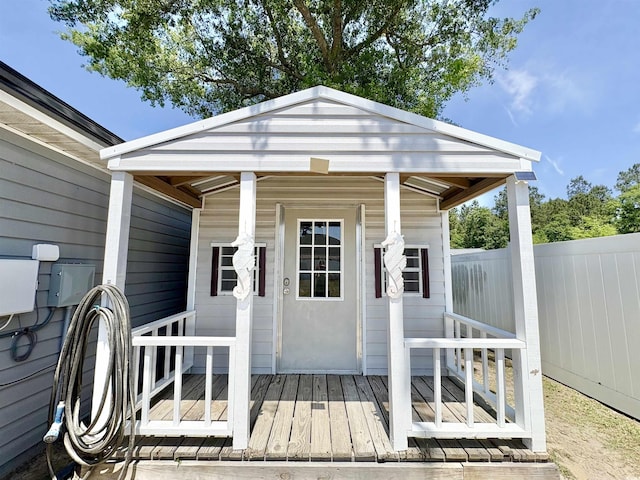 view of outbuilding with fence
