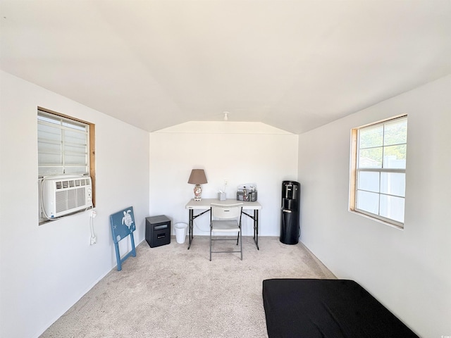 office area with light colored carpet, vaulted ceiling, and cooling unit