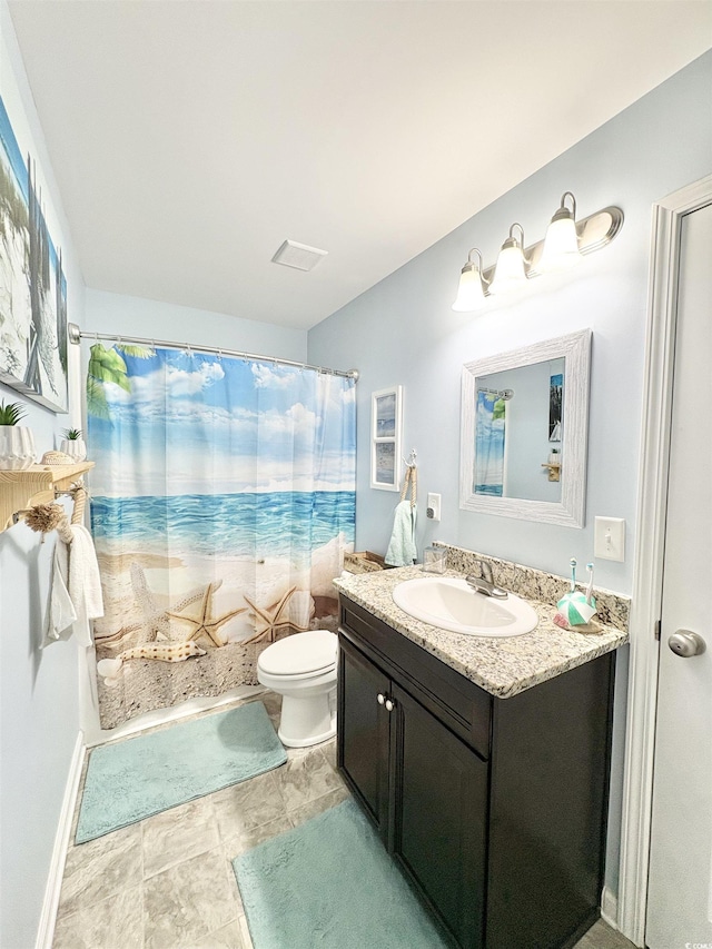 bathroom featuring vanity, shower / bath combination with curtain, and toilet