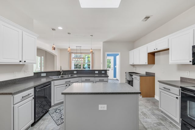 140 Zinnia Dr, Myrtle Beach, SC 29579 - kitchen with a sink, a peninsula, black appliances, visible vents, and dark countertops