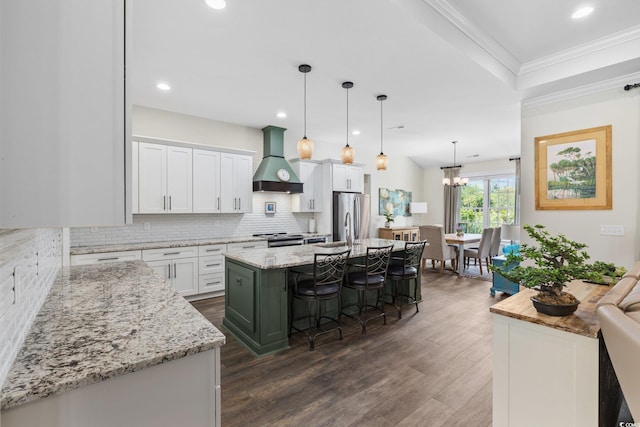 1028 Whooping Crane Dr, Conway, SC 29526 - kitchen with premium range hood, stainless steel appliances, decorative backsplash, dark wood-style flooring, and white cabinetry