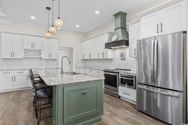 1028 Whooping Crane Dr, Conway, SC 29526 - kitchen with stainless steel appliances, premium range hood, a sink, dark wood-style floors, and recessed lighting