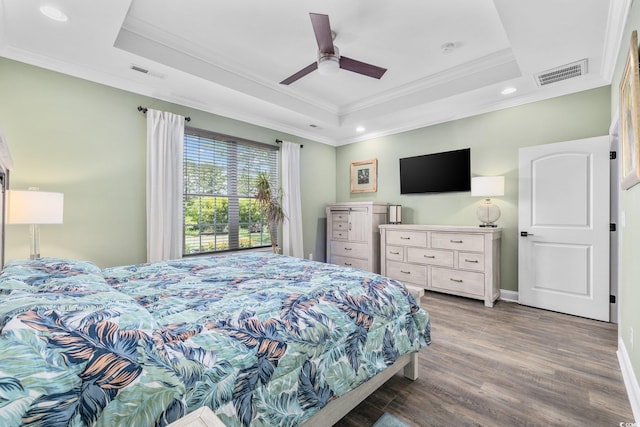 1028 Whooping Crane Dr, Conway, SC 29526 - bedroom with crown molding, a raised ceiling, wood finished floors, recessed lighting, and baseboards